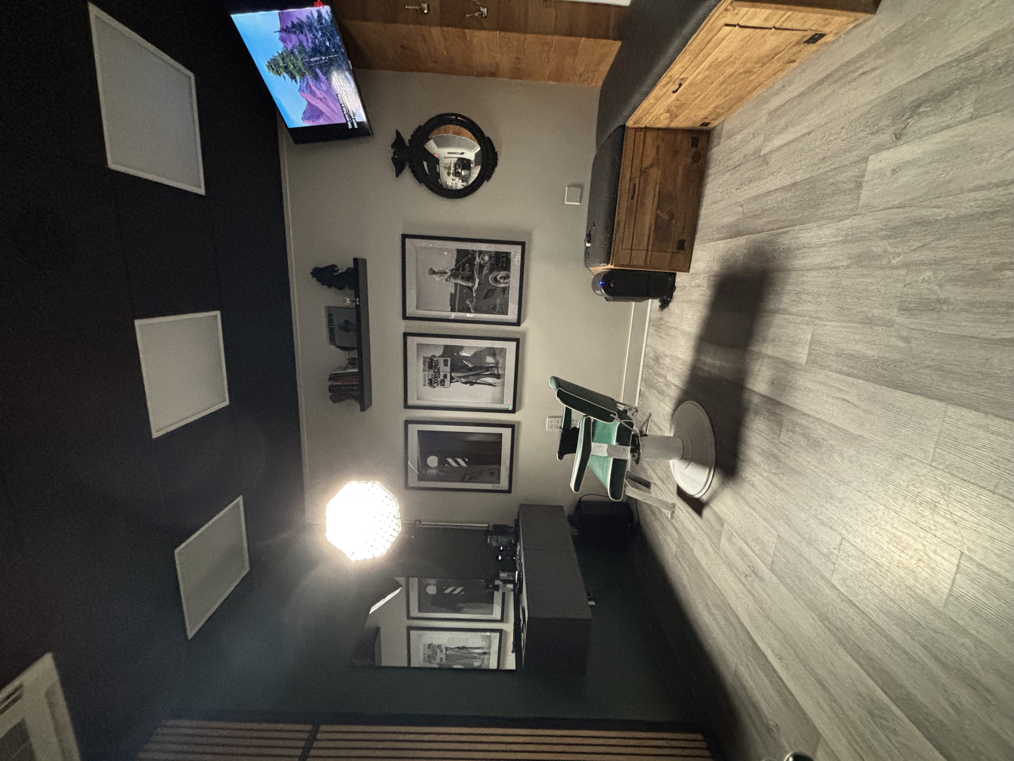 Barber chair and framed art inside The Lounge