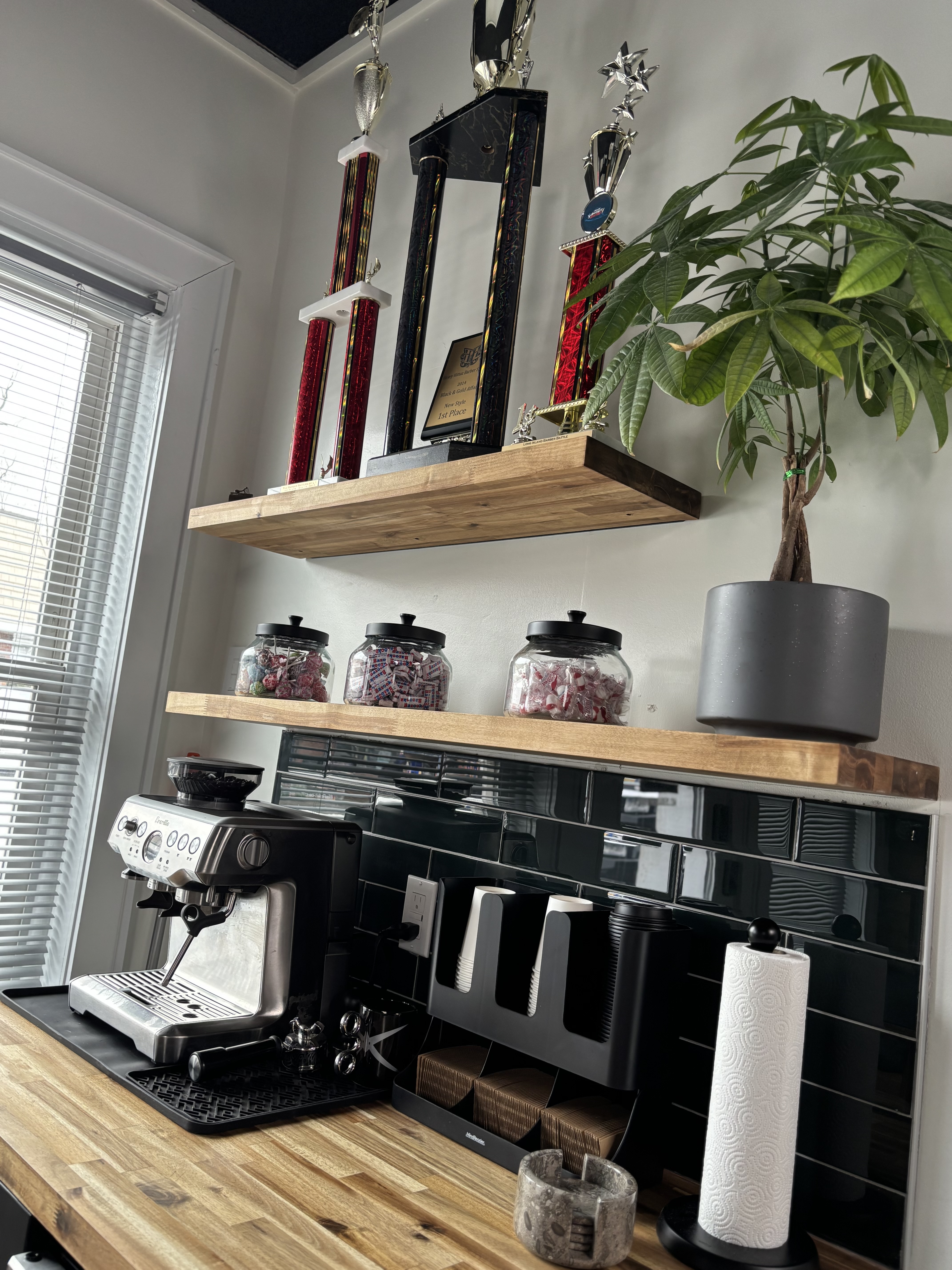 Award trophies above the coffee bar